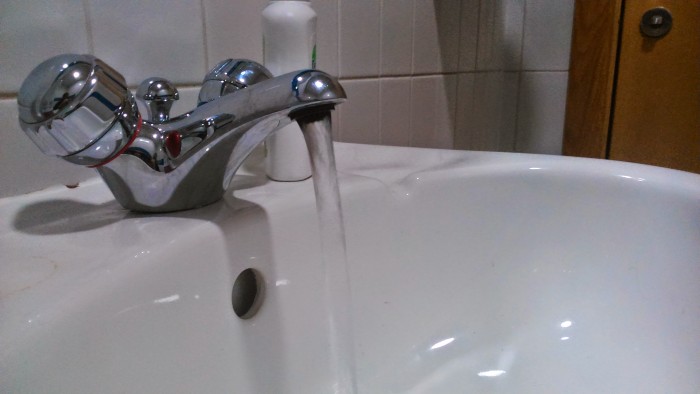 A tap with water running