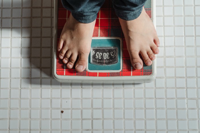 Feet on weighing scales