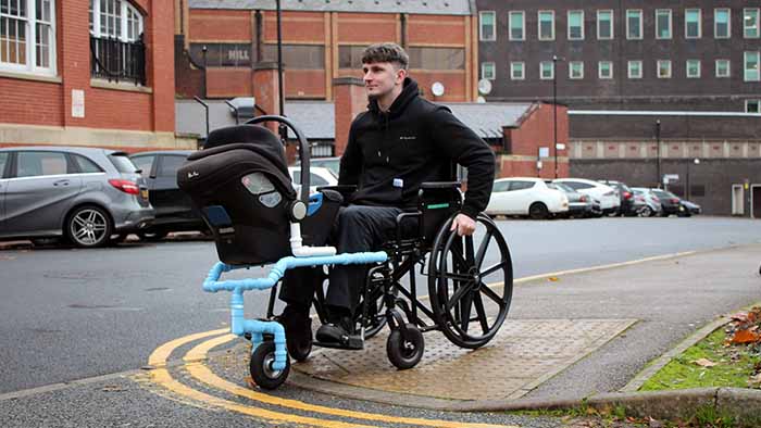 Tom using the prototype buggy design with a wheelchair