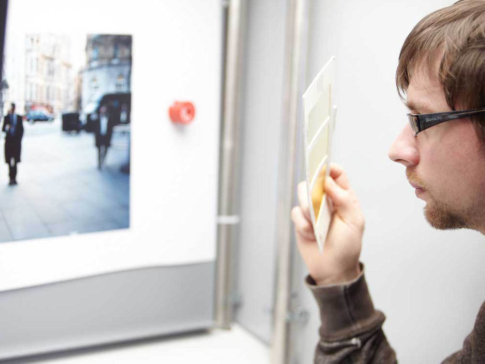 Student examining photograph