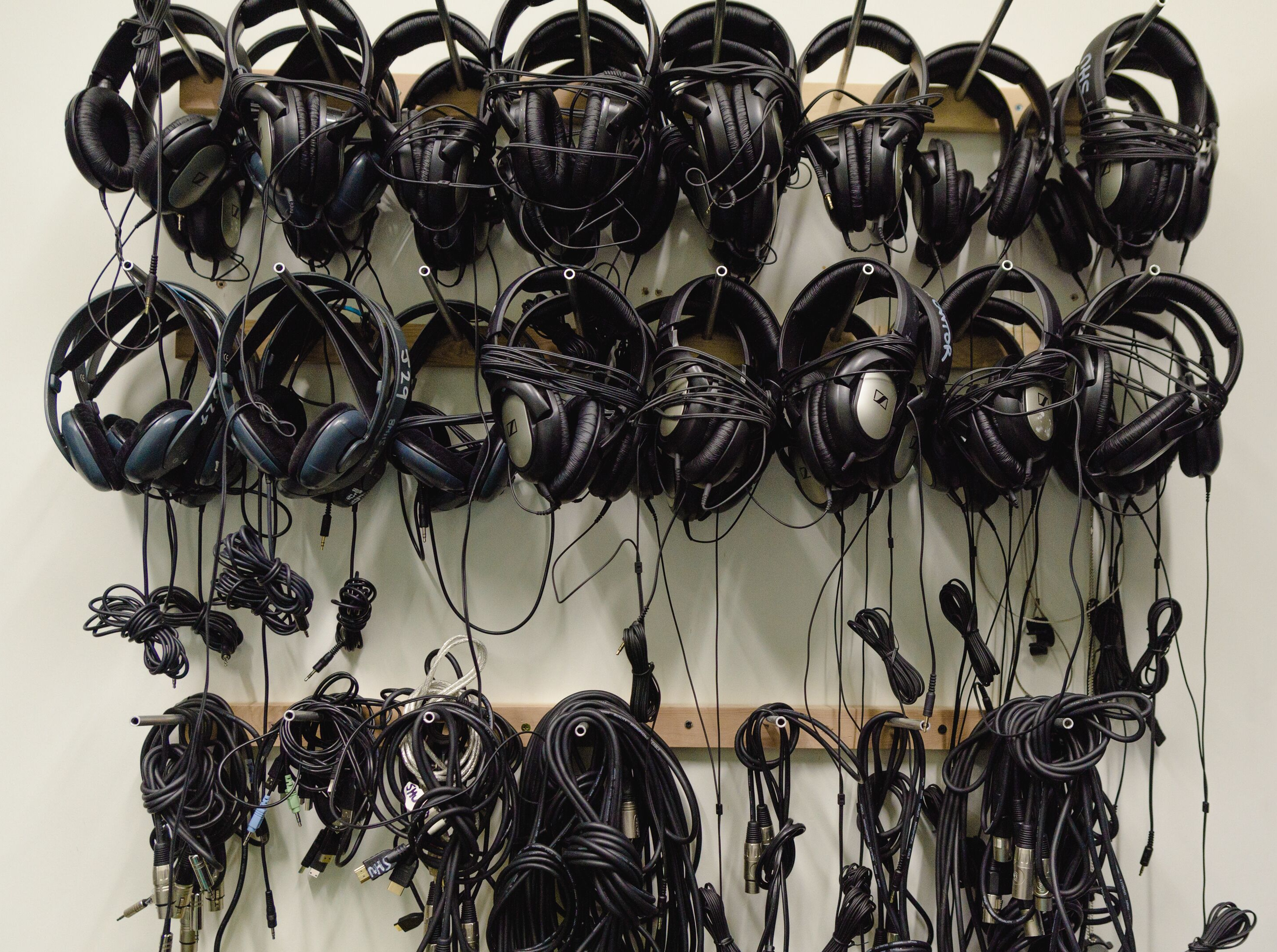 Black headphones on a wall