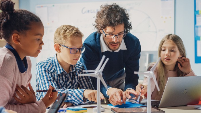 Male teacher with children