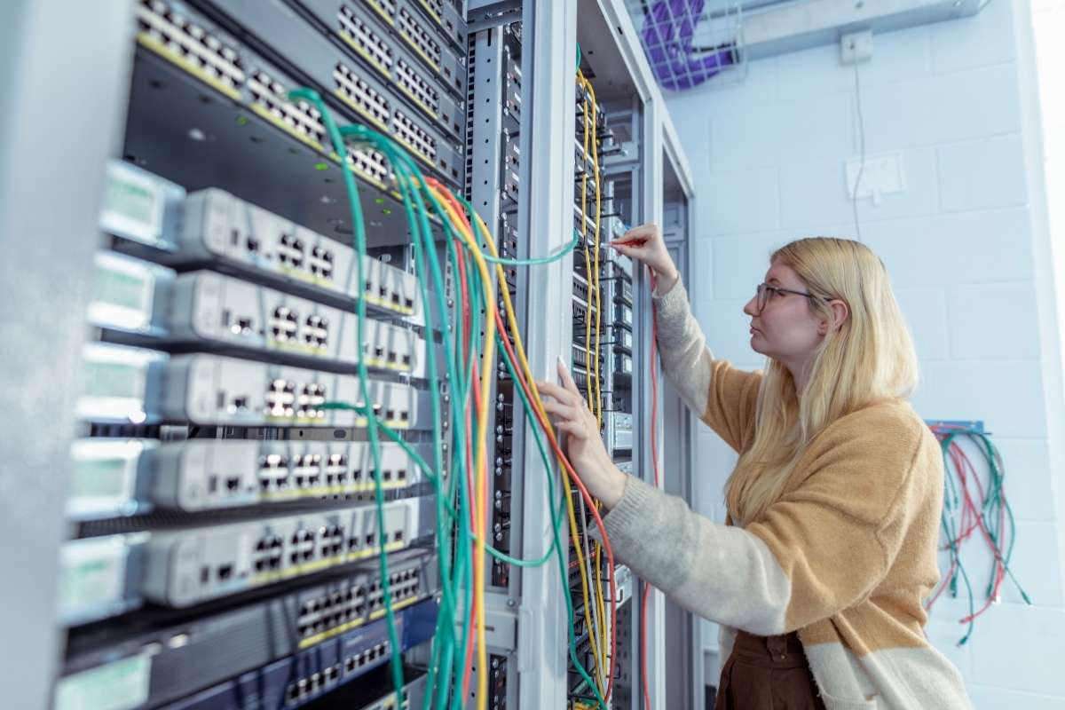 A student is working with electrical engineering equipment.