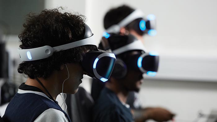Students wearing virtual reality headsets