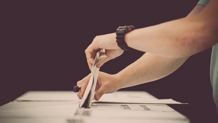 A person casting a vote in a ballot