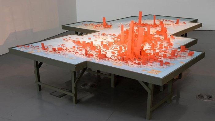 A sculpture from the Arrivals and Departures: New Art Perspectives of Hong Kong project. Hong Kong cityscape. 