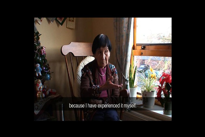 A still from a video from the Arrivals and Departures: New Art Perspectives of Hong Kong exhibition. The subtitles say 'because I have experienced it myself'