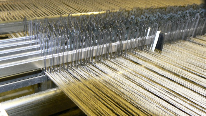 Pieces of BioThread getting woven in a loom