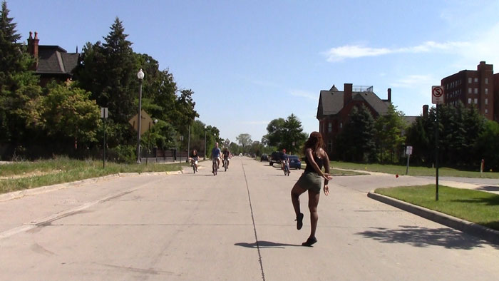 Film still: Dancing in the Street, Chloë Brown (2016) - A woman dancing in the street