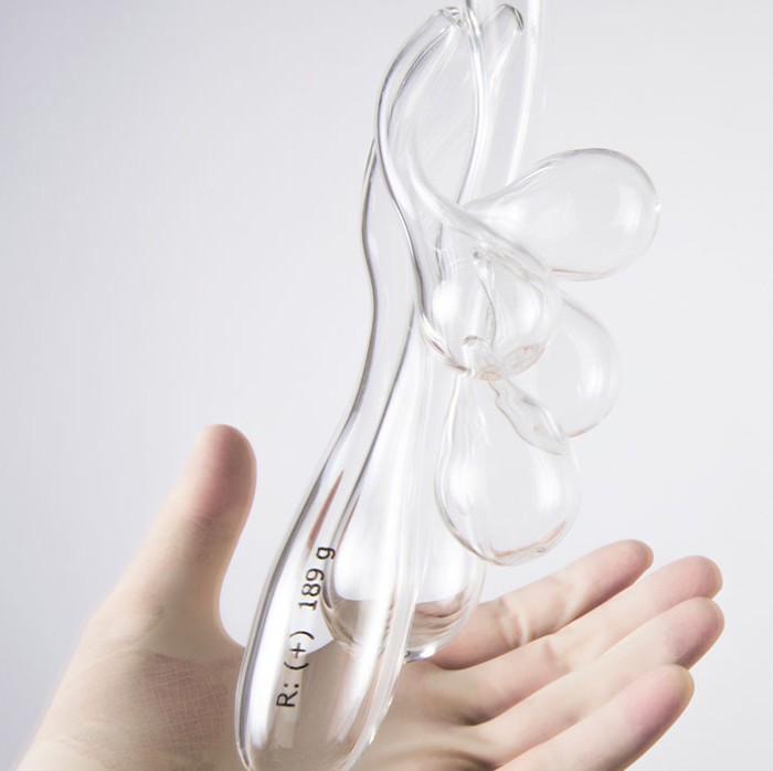 Piece of art from excessories project. Hand holding a piece of blown glass