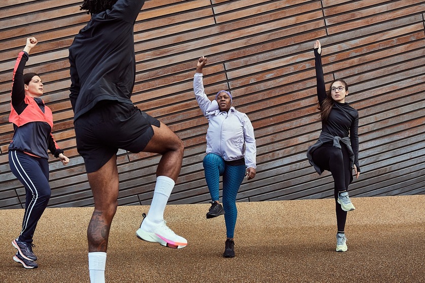 A group of people exercising outside
