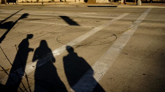 Shadows on people on a basketball court