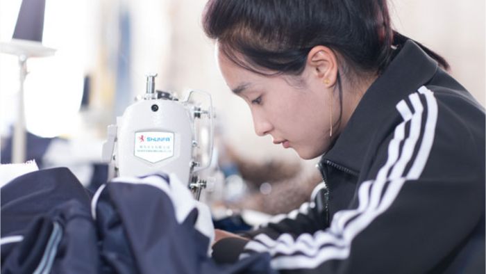 A women using a sewing machine