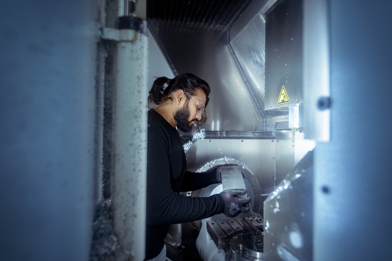 Image of someone working on some materials in a lab