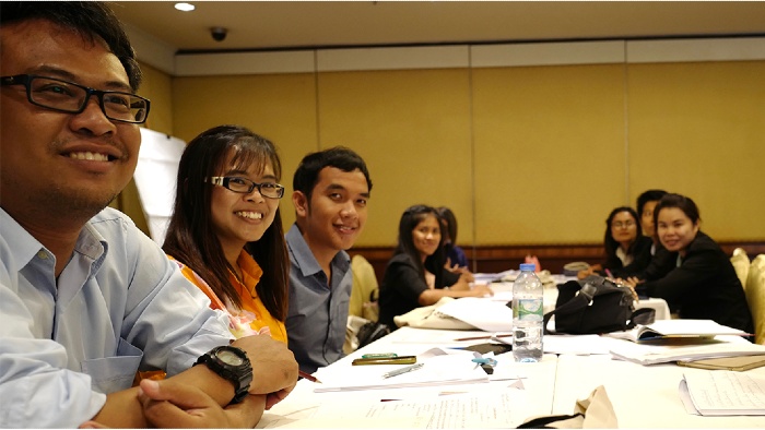 Students in a board room