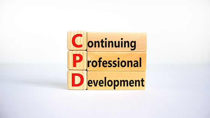 CPD, continuing professional development symbol. Wooden blocks with words CPD, continuing professional development on beautiful white background.
