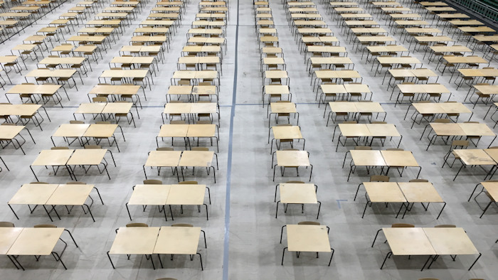 empty desks in exam hall