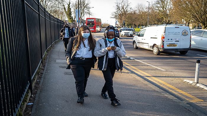 Secondary students going home from school wearing face masks