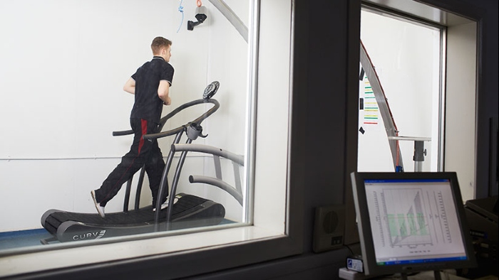 Runner on treadmill in environmental chamber
