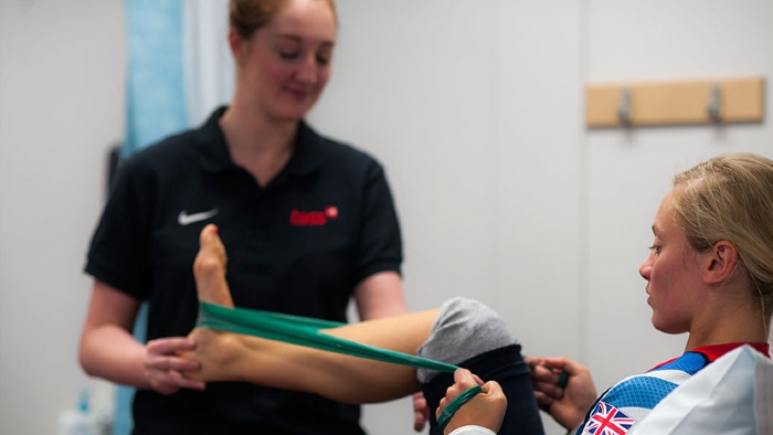 Athlete receiving physiotherapy