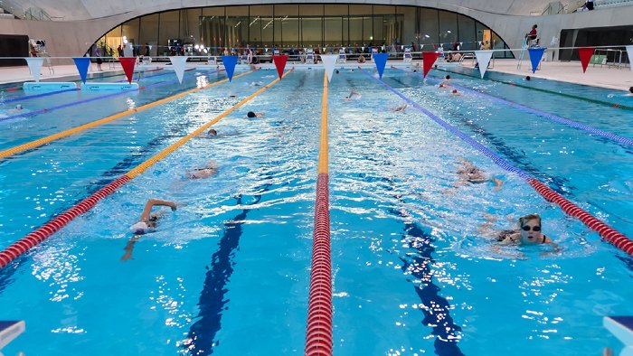 Swimmers in the London Aquatics Centre