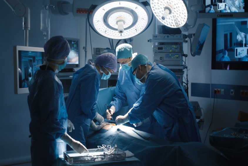 Group of surgeons working in an operating theatre