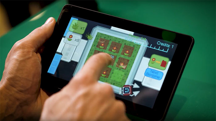 User playing a maths game on a tablet