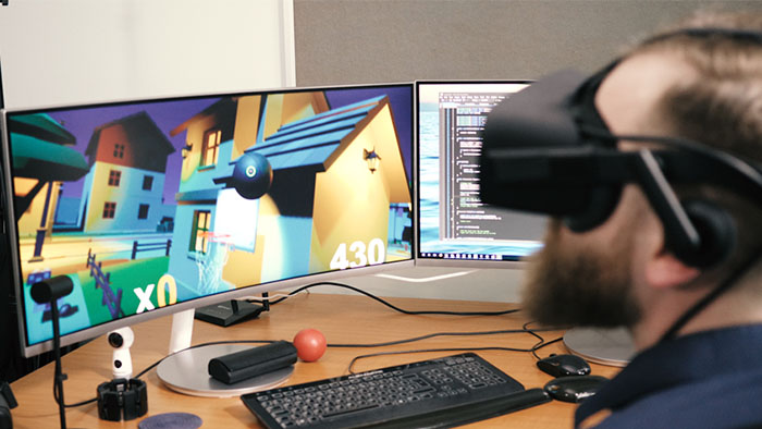 A Sheffield Hallam researcher working on a VR game