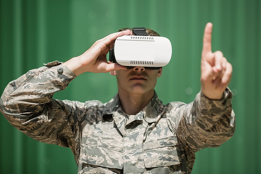 An army officer wearing a VR headset for training