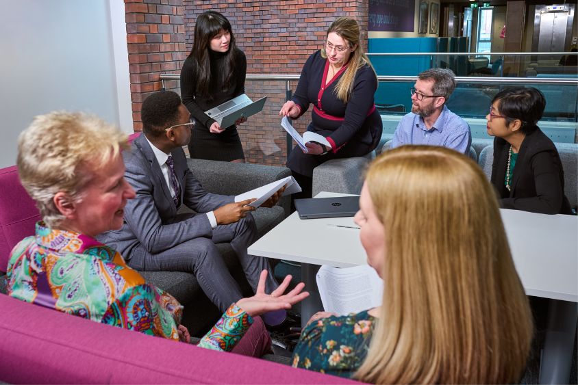 A group of people having a business meeting