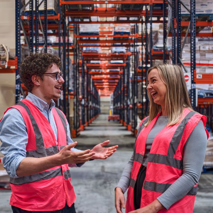 Man and woman in logistics warehouse