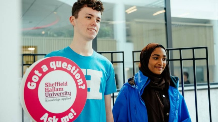 Two student ambassadors giving a tour of Sheffield Hallam University.