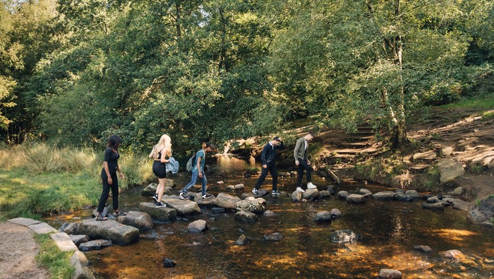 Students crossing a stream