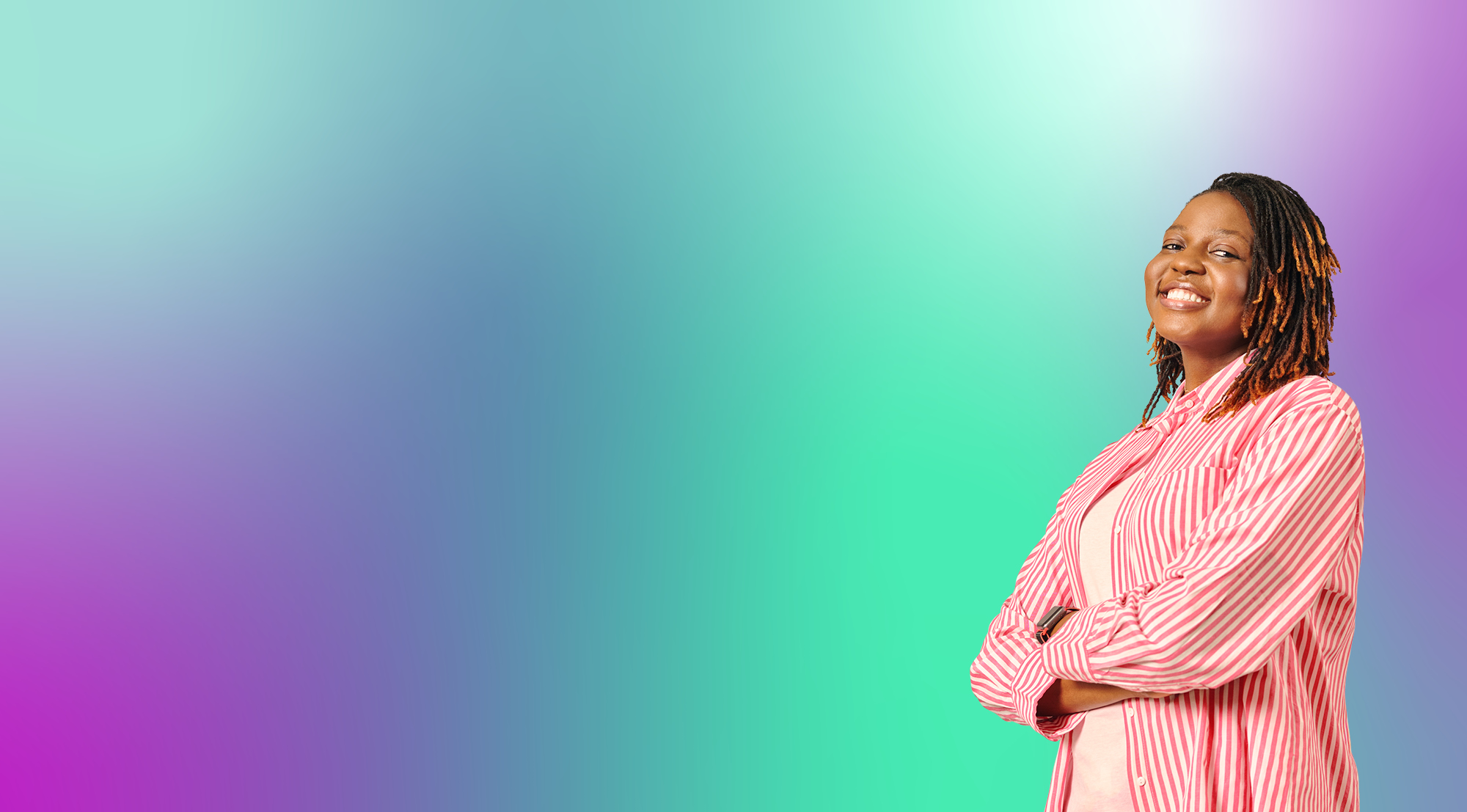 A smiling person in a pink and white striped shirt standing confidently with their arms crossed, on a colourful gradient background.
