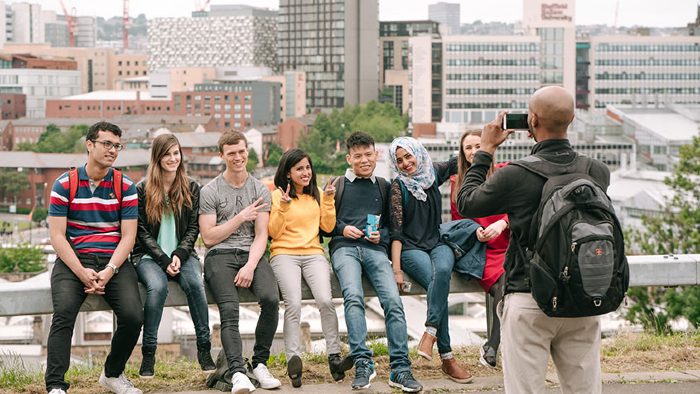 Several international students posing for a group photo