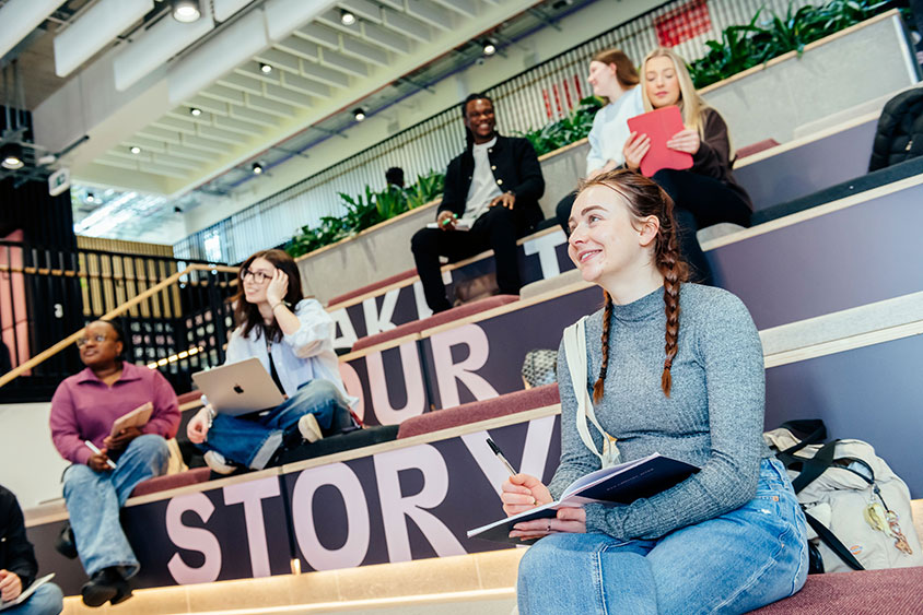 Students sat in a room in the Sheffield Hallam University business school