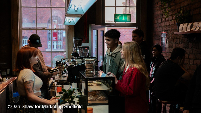 Students in a cafe ordering food and drink in Sheffield
