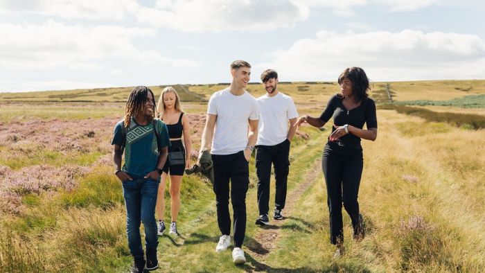 Five students walking in the Peak District