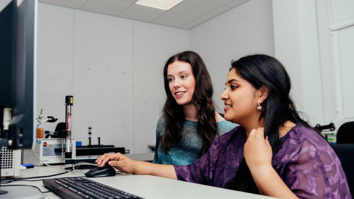 students looking at a computer