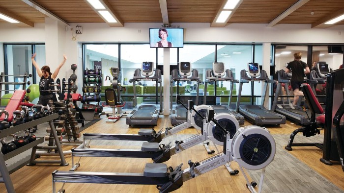 The interior of the Hallam Active. Several rowing machines, treadmills and weights are visible.