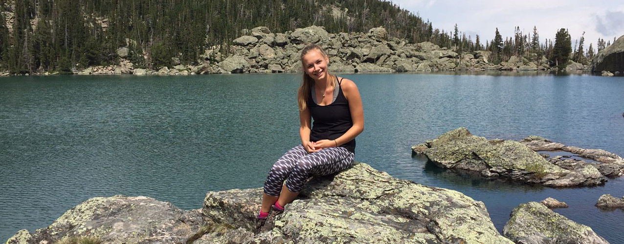Undergraduate student Amy Scott sat lake side in the USA