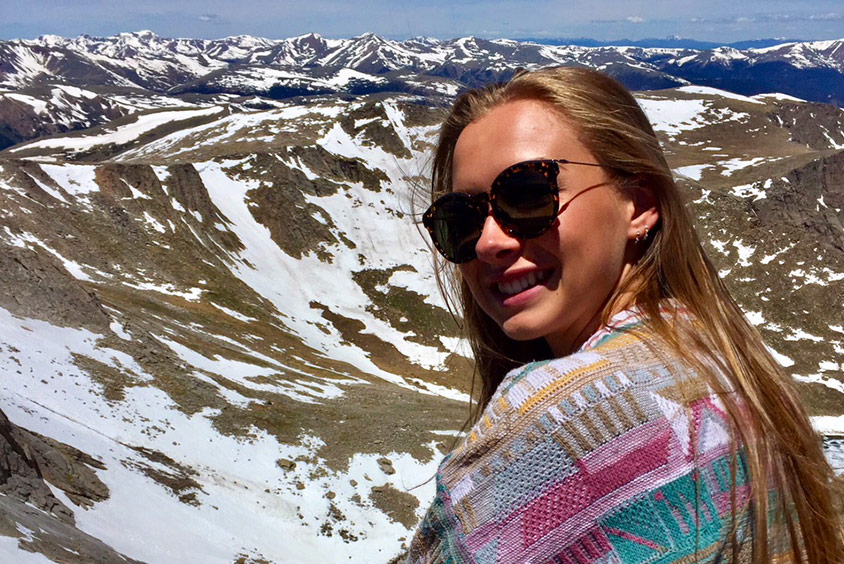 Undergraduate student Amy Scott in a mountainous region of the USA