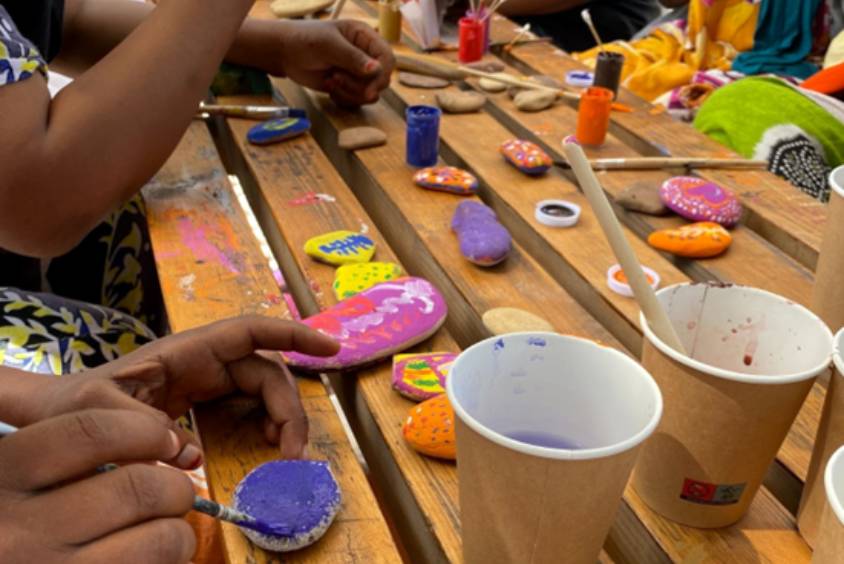 A group of people painting