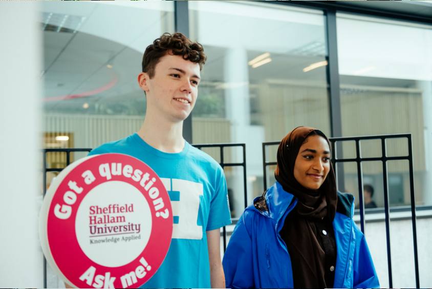 Two student ambassadors giving a tour of Sheffield Hallam University.