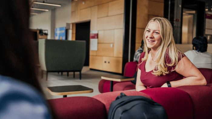 Smiling student in modern building