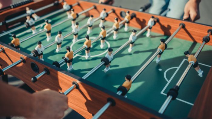 Two people playing table football