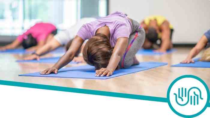 People practicing yoga with the Multifaith Chaplaincy logo